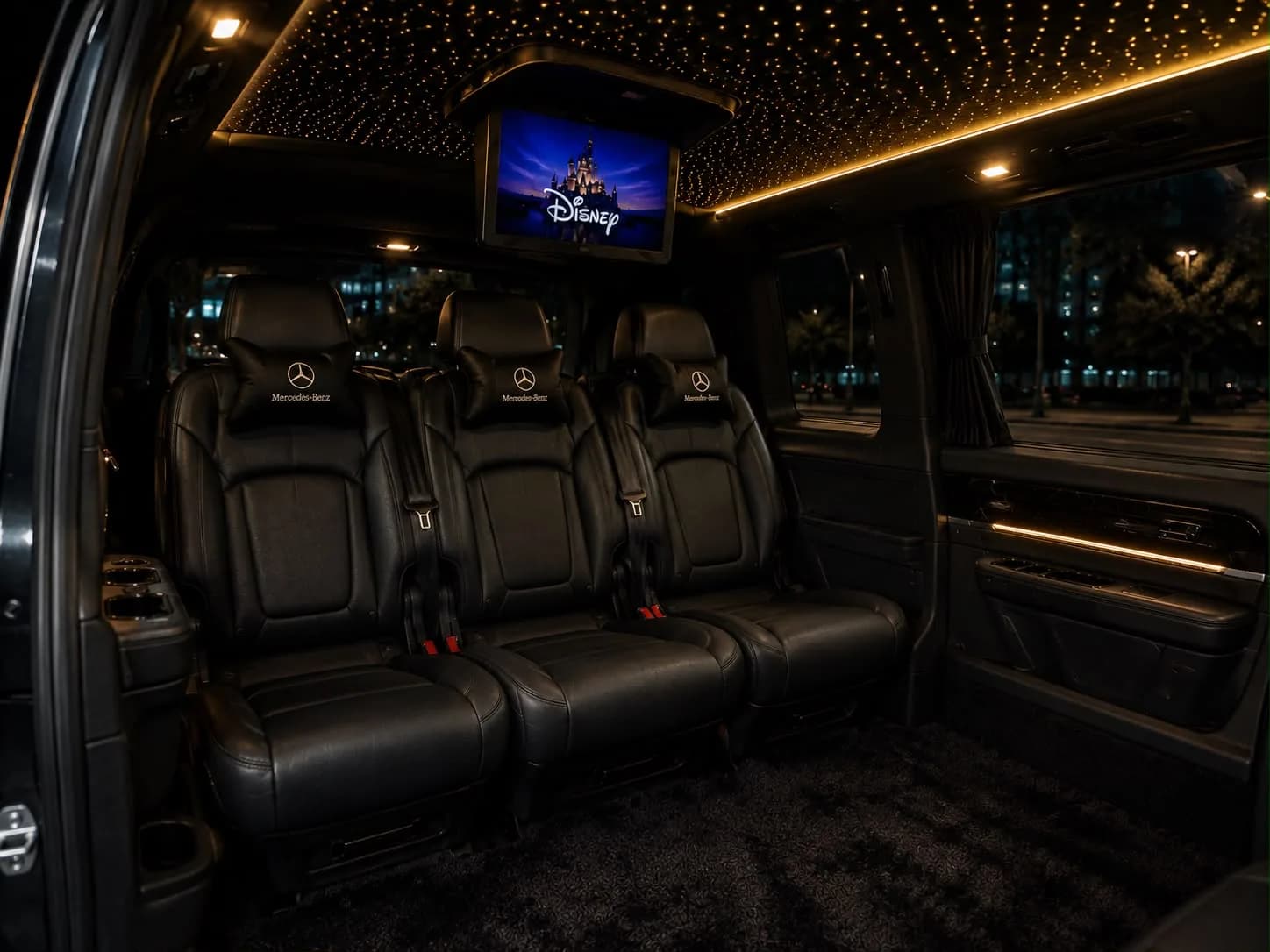 Luxury Mercedes V-Class leather seating with an on-board Disney movie screen and starlight ambience